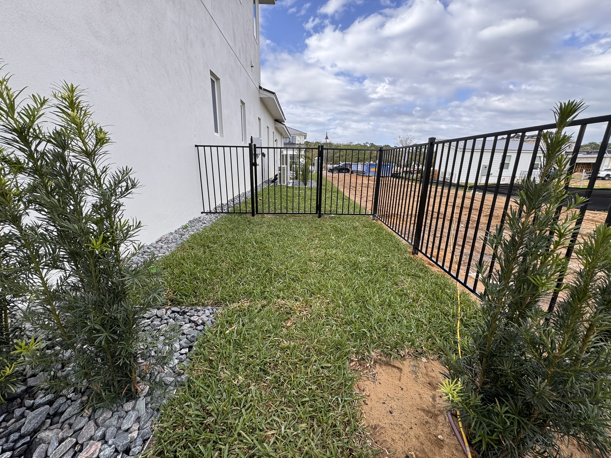 Fence Company in Maitland, FL 3 Aluminum fence installation in Maitland, FL with black powder-coated panels for elegant, low-maintenance residential security.