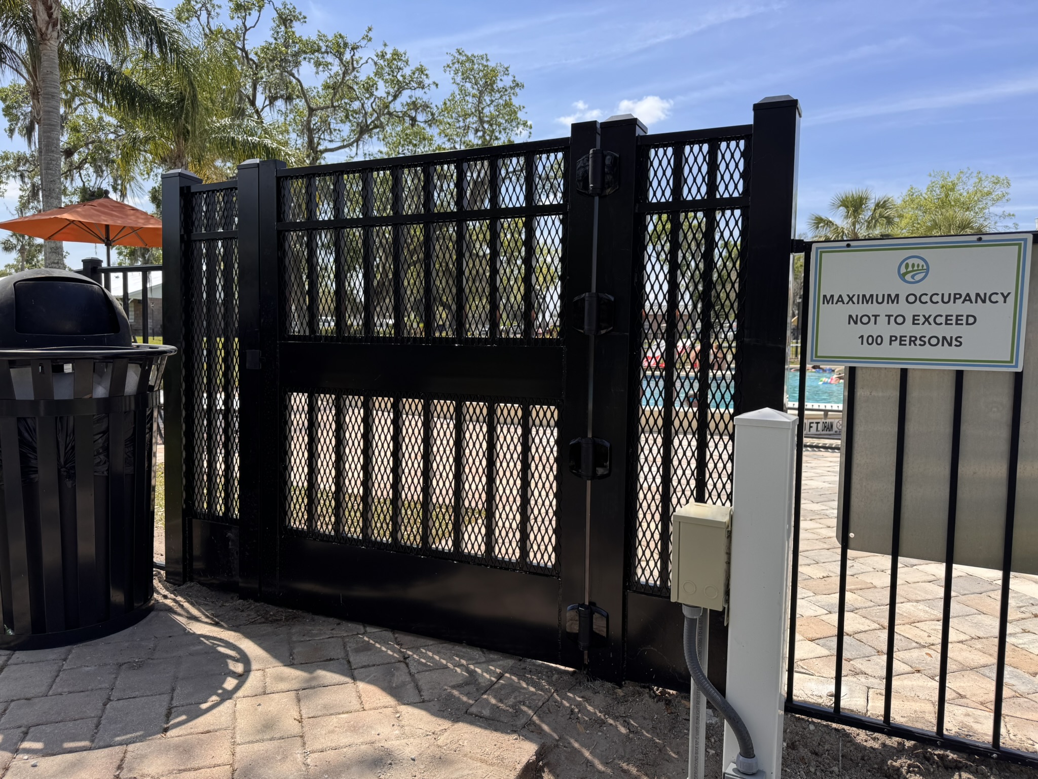 Aluminum fence installation in Ocoee, FL featuring a sleek black design with decorative finials for residential security and curb appeal.