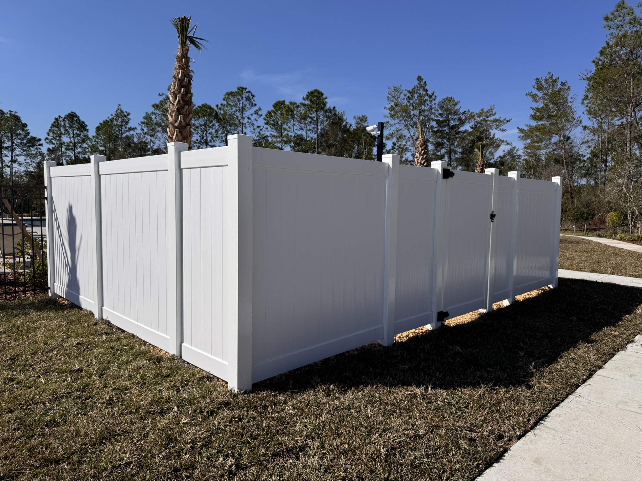 Professional Ocoee fence installation with clean lines and durable materials, enhancing residential property security and curb appeal.